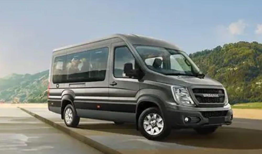 A dark grey Force Urbania van on a hill road